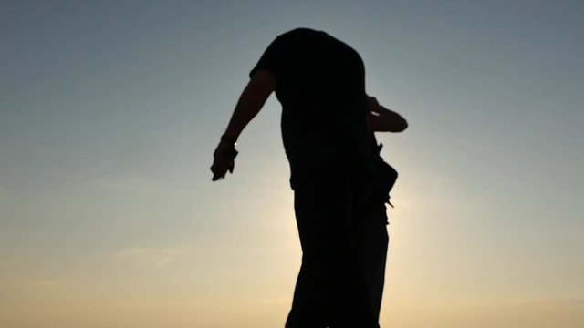 passing pedestrian stealing money from careless man silhouettes slow motion