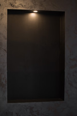 black interior decoration with light shelf