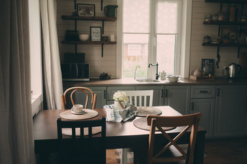 cozy cabin interior. Country grey kitchen with open shelfin in rustic style. Rural life concept