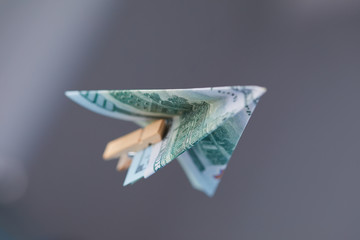 dollar banknote paper airplane