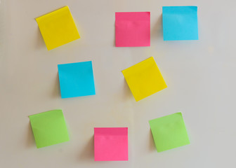 Colorful paper stickers for refrigerator on the light background. Mock up for design.