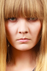 Angry looking woman, face covered in fringe