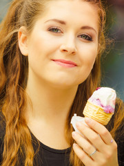 Young woman eating ice cream