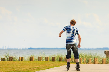 Young man rollerblading outdoor on sunny day