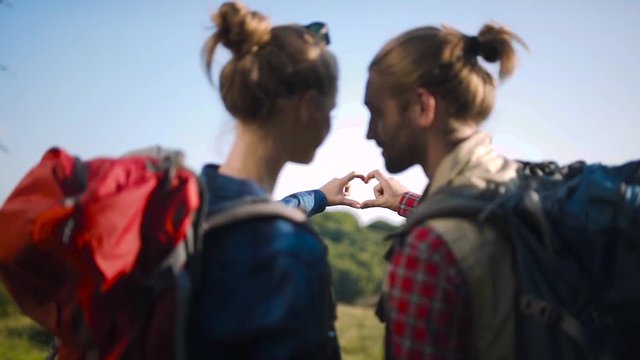 Tourist Couple In Love Traveling, Making Heart Sign With Hands.