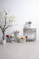 Elegant interior decoration with flowers on  white wedding background