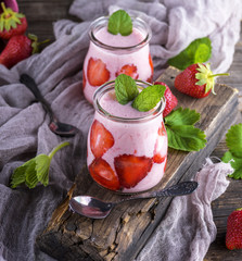 smoothies of fresh strawberries and yogurt in a glass jar