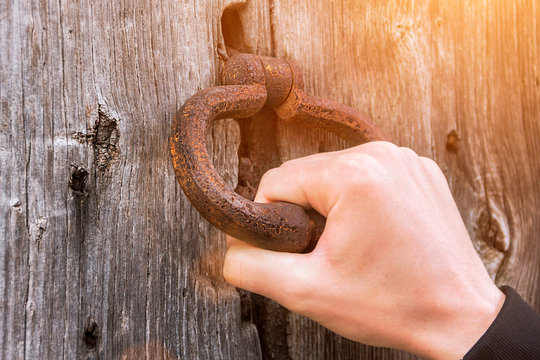 Old Bell At The Door, Hand Knocks On The Wooden Door