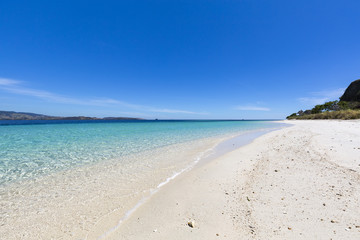 A beautiful empty beach on a small island in the Seventeen Island National Park, Flores, Indonesia.