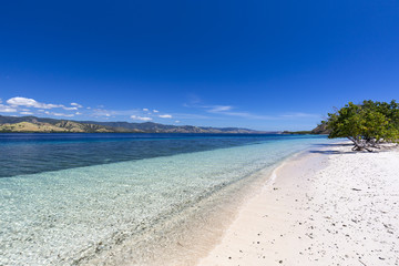 Beautiful warm tropical water on a beach in the Seventeen Island National Park in Flores, Indonesia.