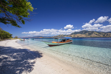 A Boat on tropical beach in the Seventeen Island National Park, Indonesia.