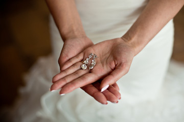 Morning of the bride. Beautiful bride getting dressed and preparing for the wedding