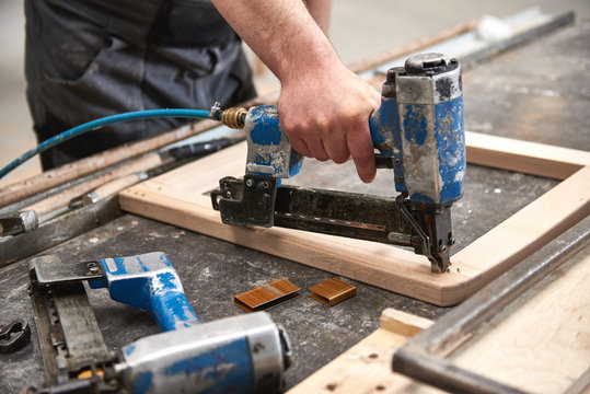 Nail Gun Tools On Metal Table