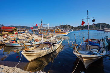 Obraz premium Marine parking of boats and yachts in Kekova is a sunken city in Turkey.