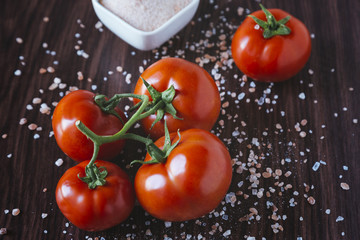 Organic tomatoes on a wooden background
