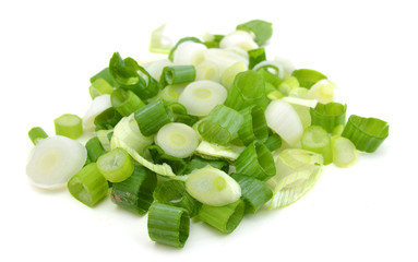 chopped green onions on white