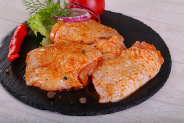 Raw marinated chicken thighs