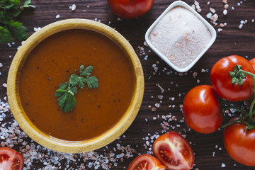 Tomato soup in a wooden bowl
