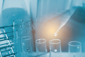 Dropping chemical liquid to test tube, laboratory research and development concept. scientist sample chemistry or medicine test