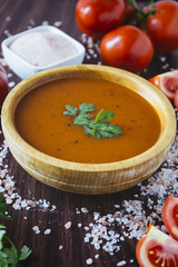Tomato soup in a wooden bowl