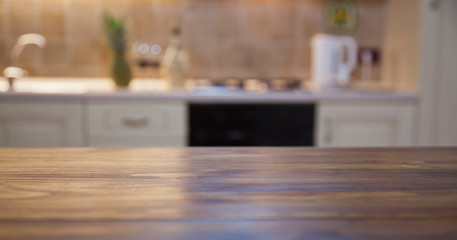 blurred kitchen interior with wooden desk space