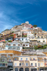 Obraz premium Positano Amalfi Coast Naples Italy - Abstract view of the village colored houses against a blue windy sky.