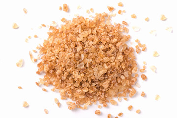 Brown sugar isolated on white background. top view