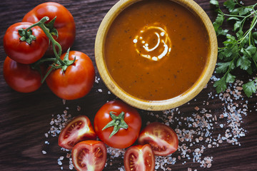 Tomato soup in a wooden bowl