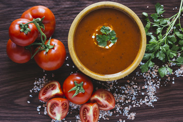 Tomato soup in a wooden bowl