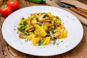 Fried potatoes with mushrooms