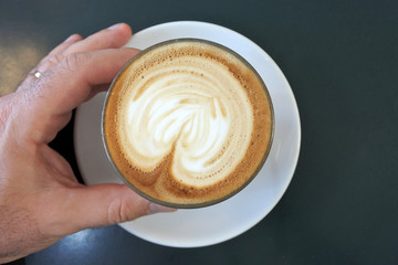 Man drinks flat white coffee drin