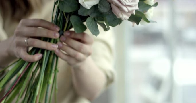 Young Florist Assembles a Rustic Wedding Bouquet