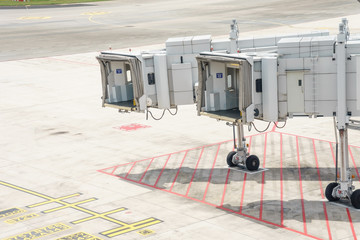 Airplane bridge in airport for passengers boarding or Jetway waiting for a plane to arrive on airport or airport terminal boarding gate.