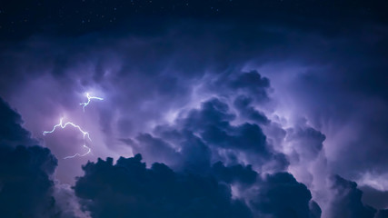 Naklejka na ściany i meble Lightning Bolt in Dark Storm Clouds