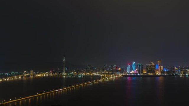 night illuminated macau cityscape traffic bridge rooftop panorama 4k timelapse china
