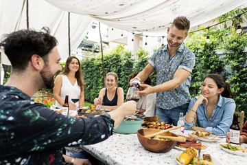 Group of diverse friends enjoying summer party together