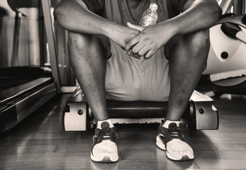 Man taking a break from a workout