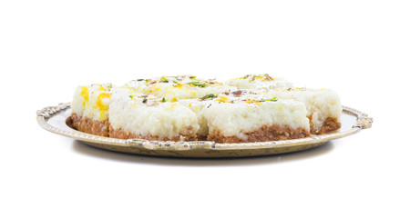 Indian Diwali Sweet Food Kalakand Also Know as Halwa or Mawa Kalakand is a Creamy Delicacy Made From Paneer or Cottage Cheese, The Dish Originated in Alwar, Rajasthan. Isolated on White Background