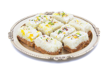 Indian Diwali Sweet Food Kalakand Also Know as Halwa or Mawa Kalakand is a Creamy Delicacy Made From Paneer or Cottage Cheese, The Dish Originated in Alwar, Rajasthan. Isolated on White Background