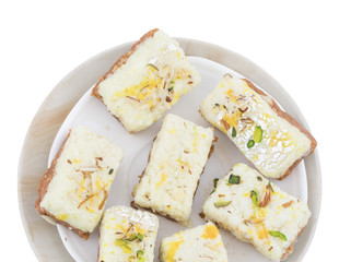 Indian Diwali Sweet Food Kalakand Also Know as Halwa or Mawa Kalakand is a Creamy Delicacy Made From Paneer or Cottage Cheese, The Dish Originated in Alwar, Rajasthan. Isolated on White Background