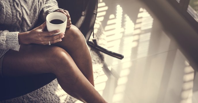 Woman having a warm cup of coffee