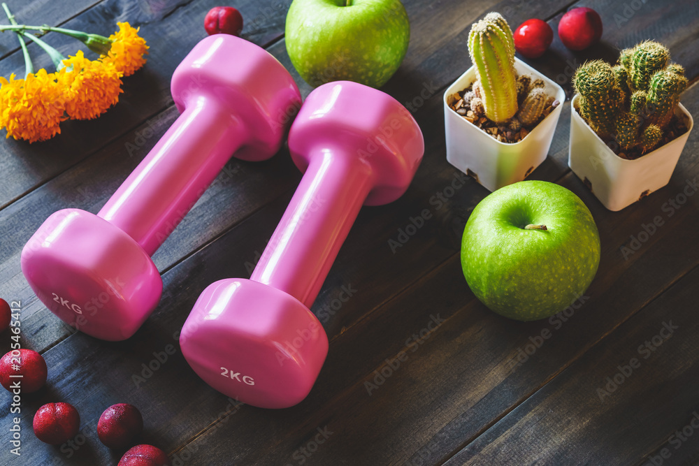 Canvas Prints still life of women's healthy and active lifestyle dieting concept. pink dumbbells with green apples