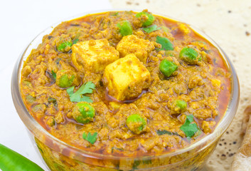 Indian Cuisine Mattar Paneer is a Vegetarian North Indian Dish Consisting of Peas And Paneer in a Tomato Based Sauce, Spiced with Garam Masala. It is often Served with Indian type of Tandoori Roti