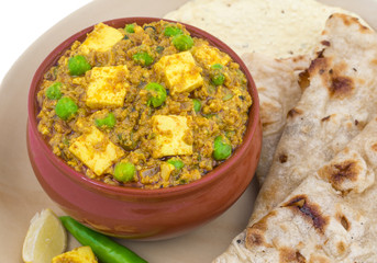 Indian Cuisine Mattar Paneer is a Vegetarian North Indian Dish Consisting of Peas And Paneer in a Tomato Based Sauce, Spiced with Garam Masala. It is often Served with Indian type of Tandoori Roti