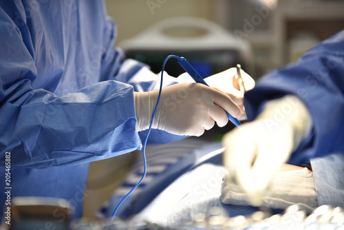 Operating Room Scrub Nurse Preparing Medical Instruments