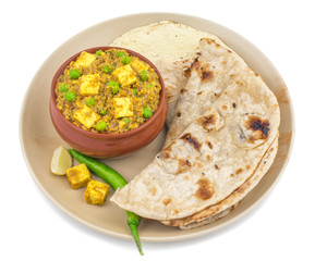 Indian Cuisine Mattar Paneer is a Vegetarian North Indian Dish Consisting of Peas And Paneer in a Tomato Based Sauce, Spiced with Garam Masala. It is often Served with Indian type of Tandoori Roti