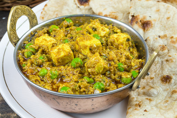 Indian Cuisine Mattar Paneer is a Vegetarian North Indian Dish Consisting of Peas And Paneer in a Tomato Based Sauce, Spiced with Garam Masala. It is often Served with Indian type of Tandoori Roti