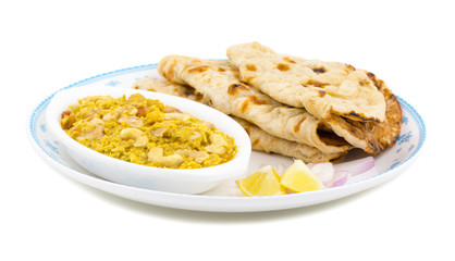 Indian Traditional Vegetarian Cuisine Kaju Curry Also Called Kaju Butter Masala Served With Tandoori Roti And Salad isolated on White Background