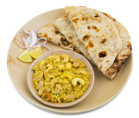 Indian Traditional Vegetarian Cuisine Kaju Curry Also Called Kaju Butter Masala Served With Tandoori Roti And Salad isolated on White Background