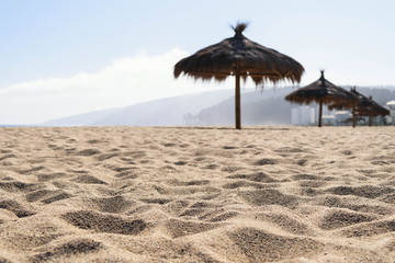 Seascape view sand and umbrellas, Hills of sand seascape background in nature with copy space